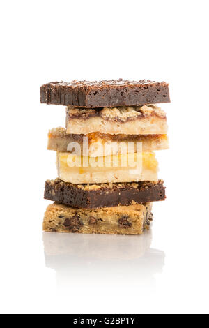A stack of cookies, bars and brownies piled high on a white background. Stock Photo
