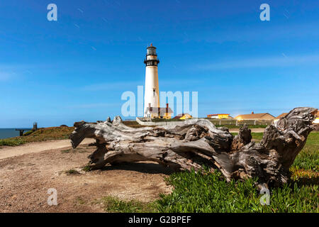 Pigeon Point Lighthouse. Located in Pecadero, California. Image is a long exposure shot of the lighthouse and log set in a trail Stock Photo