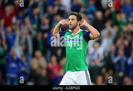 Northern Ireland's Will Grigg celebrates scoring his side's third goal during the International Friendly at Windsor Park, Belfast. Stock Photo