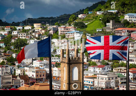 British and French flags fly from Fort George over St Andrews Presbyterian Church and town of St. Georges, Grenada Stock Photo