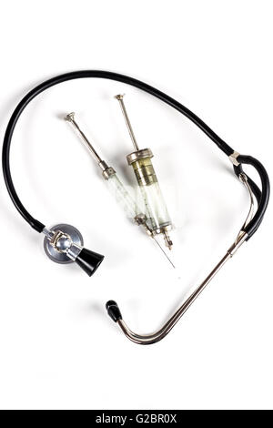 Glass Syringe With Black Old Stethoscope on White Background Stock Photo