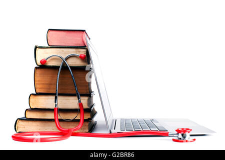 Red Stethoscope and Old Books  With Silver Laptop Isolated on White Bakcground Stock Photo