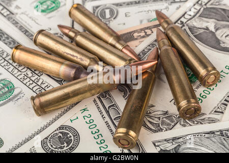 American Dollar Bancknotes with Rifle  Bullets Stock Photo