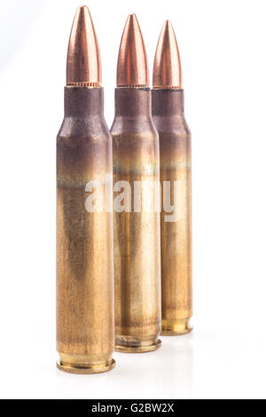 Three Isolated Bullets On White Background With Reflection Stock Photo
