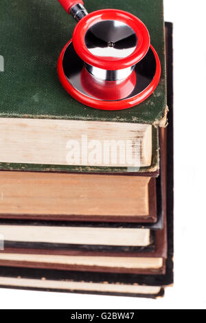 Old Books Red Stethoscope Isolated on White Background Stock Photo
