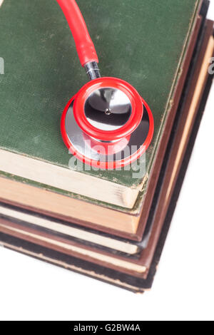 Old Books Red Stethoscope Isolated on White Background Stock Photo