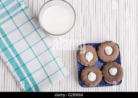 Four Cookies on Blue plate and white wood Stock Photo