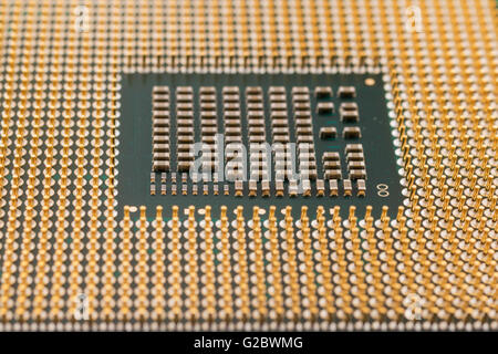 Geometry electronics, closeup of CPU Processor Chip, view from the bottom side, pin connectors, as a background, texture Stock Photo