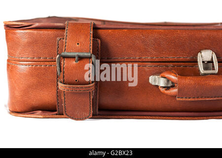 Old Brown leather used and weathered suitcase isolated on white background Stock Photo