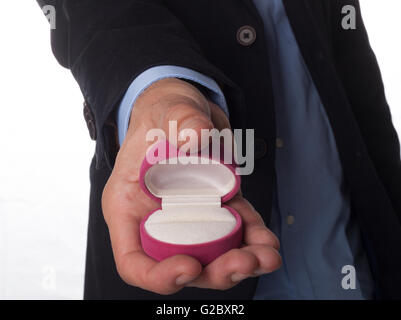 Man Hand in Suit Holding Empty Pink Jewelry Box Isolated on White Background Stock Photo