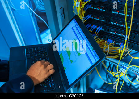 Fix network switch in data center room . Stock Photo