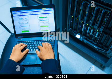 Man fix server network in data center room . Stock Photo