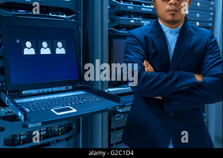 Man fix server network in data center room . Stock Photo