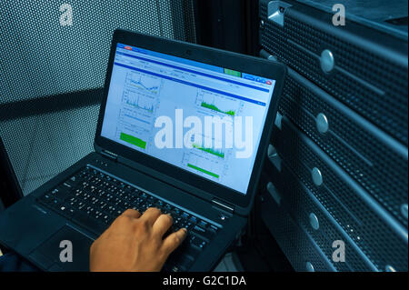 Man fix server network in data center room . Stock Photo