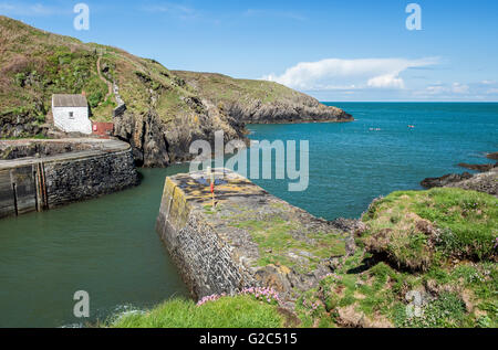 Entrance to Porthgain Harbour on the Pembrokeshire Coast National Park Coastline, west Wales, on a sunny Spring day Stock Photo