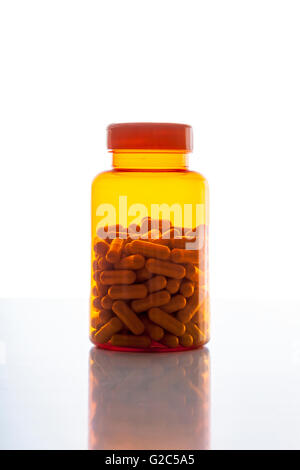 Orange bottle with pills Stock Photo