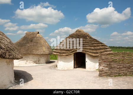 Collection of medieval dwellings. White buildings with thatched roofs. Stock Photo