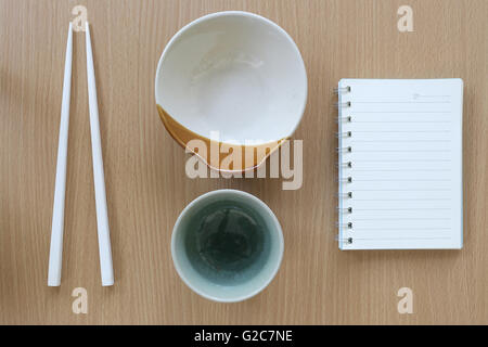 kitchen utensils and note book on wood background for design Concept in food. Stock Photo