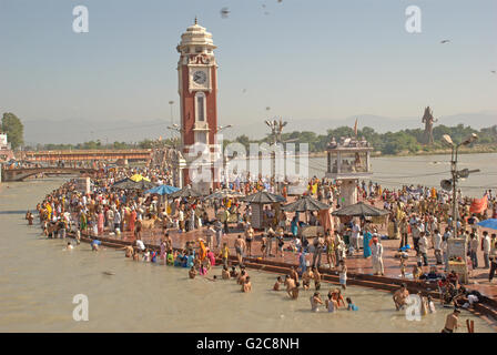Religious activities and holy dip in the Ganga river by Hindu pilgrims, Har ki Paudi, Haridwar, Uttarakhand, India Stock Photo