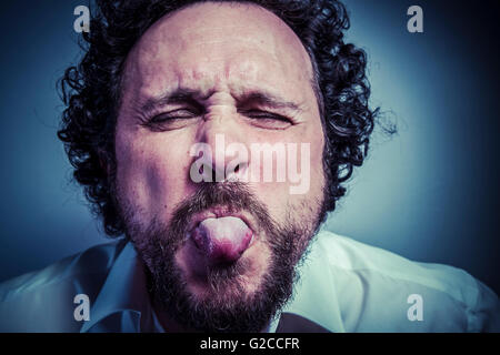 derision, man with intense expression, white shirt Stock Photo