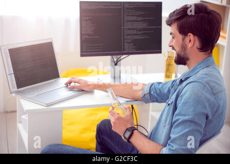 Man working on his laptop Stock Photo