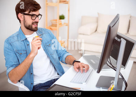 Guy working on his computer Stock Photo