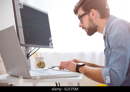 Man programming on his computer Stock Photo