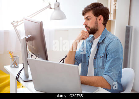 Man thinking over some details Stock Photo