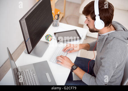 Man looking at the computer Stock Photo