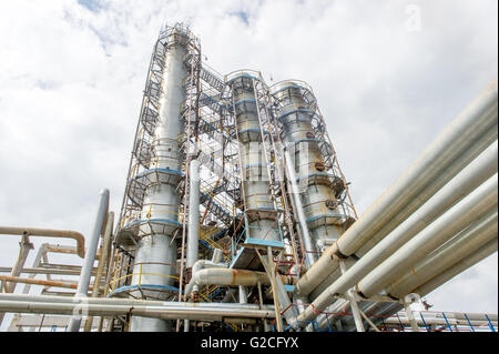 Industrial equipment and pipelines at the gas processing plant on a summer day Stock Photo