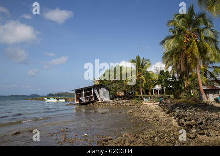 Chea Village, Solomon Islands - May 31, 2015: Destroyed house along the coastline in a village on the Solomon Islands Stock Photo