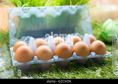 Eggs in plastic container Stock Photo