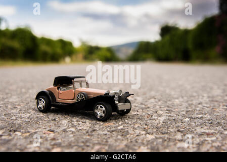 Early 1900s old toy car still life image. Stock Photo