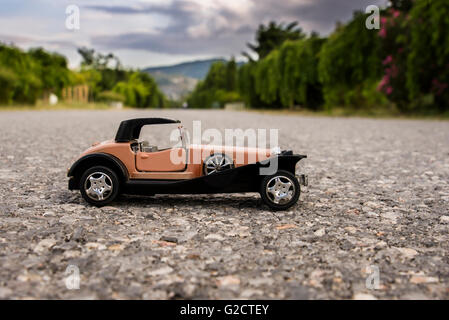 Early 1900s old toy car still life image. Stock Photo