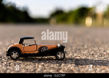 Early 1900s old toy car still life image. Stock Photo