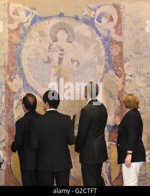French President Francois Hollande, left, departs after visiting the ...