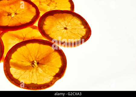 Group of orange slices against the light. Close up. Elevated view Stock Photo