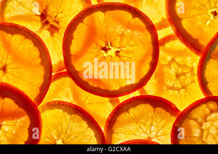 Group of orange slices against the light. Close up.Top view Stock Photo