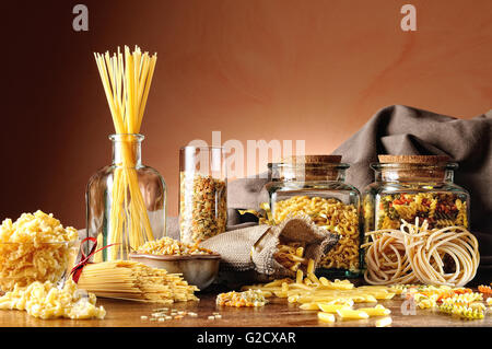 composition with various types of pasta presented on a wooden table overview Stock Photo