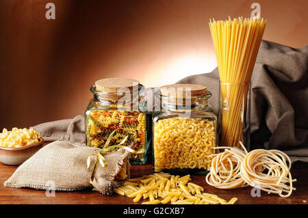 composition with various types of pasta presented on a wooden table Stock Photo