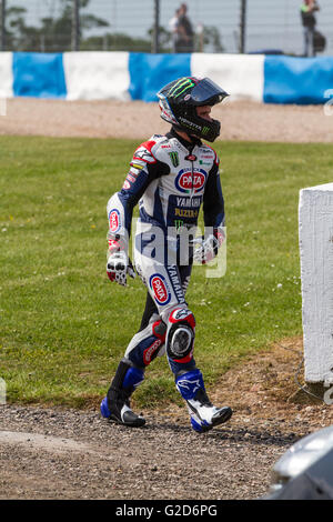 Donington Park,  UK. 28th May, 2016. Cameron Beaubier walking away after his first lap crash at Goddards corner Credit:  steven roe/Alamy Live News Stock Photo