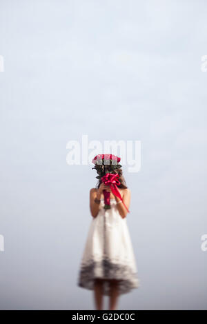 Young woman with a bouquet of red roses Stock Photo - Alamy