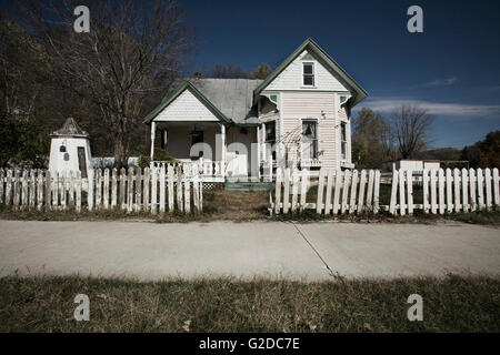 Rundown House With Picket Fence and Overgrown Lawn, Grafton, Illinois, USA Stock Photo