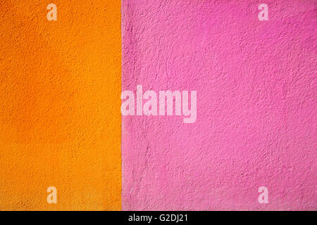 Fondamenta Cavanella, Burano, Venetian Lagoon, Italy: the junction between two brightly coloured houses close-up and abstract Stock Photo