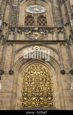 Detailed view of gold window and the clock tower of Cathedral of st. Vitus (Prague, Czech Republic) Stock Photo