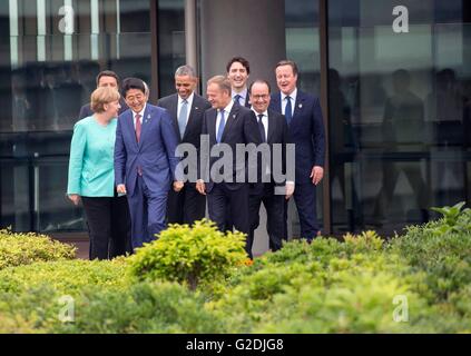 World leaders at the G7 Summit meeting walk out to the roof garden of the Shima Kanko Hotel for a group photo May 26, 2016 in Shima, Mie Prefecture, Japan. Left to Right: German Chancellor Angela Merkel, Italian Prime Minister Matteo Renzi, Japanese Prime Minister Shinzo Abe, U.S President Barack Obama, European Council President Donald Tusk, Canadian Prime Minister Justin Trudeau, French President Francois Hollande and British Prime Minister David Cameron. Stock Photo