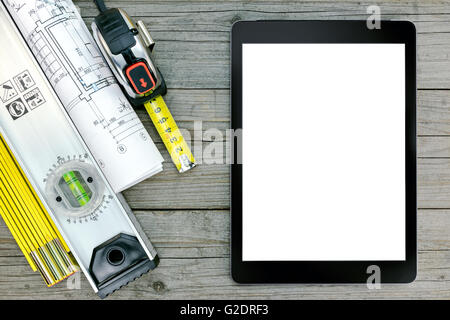 architectural blueprints with contractor work tools with floor plan on wooden desk Stock Photo