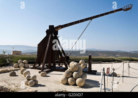 Model of a catapult and projectiles in exhibition in the Fortaleza de La Mota, Spain Stock Photo