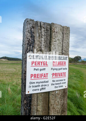 Danger, flying golf balls warning sign at St David's golf club in Harlech Wales UK Stock Photo