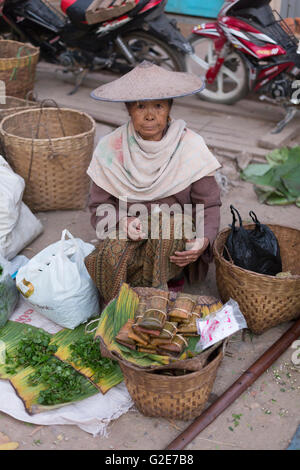 Woman selling vegetables, fruits and other food, in a market, Myanmar, Burma, Southeast Asia, Asia